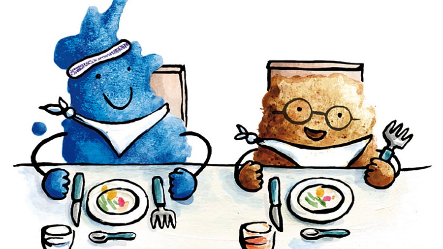 Comicfiguren Klecks in blau und Krümel in braun am Esstisch