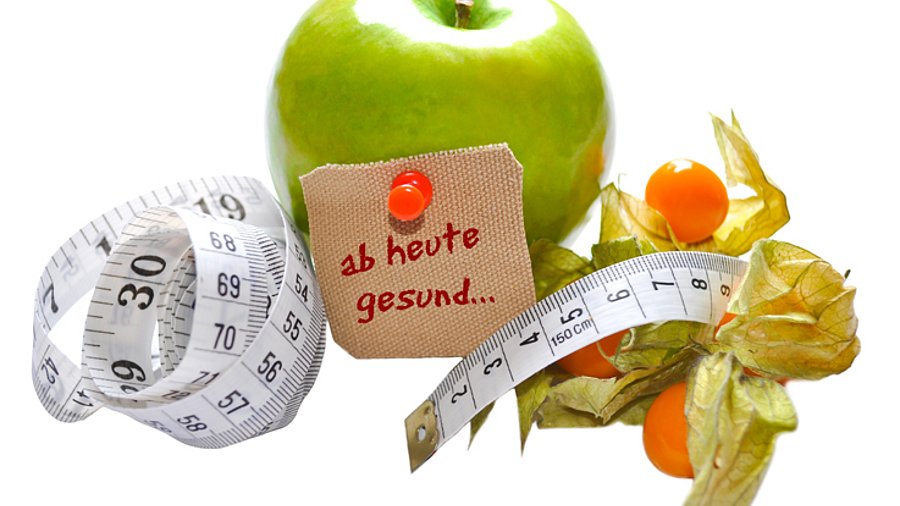 Apfel, Maßband und Schriftzug "ab heute gesund" (Symbolfoto)